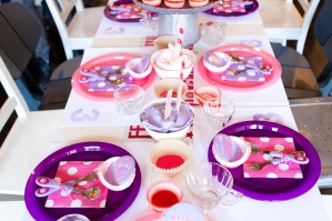 Pink and purple cupcake decorating station