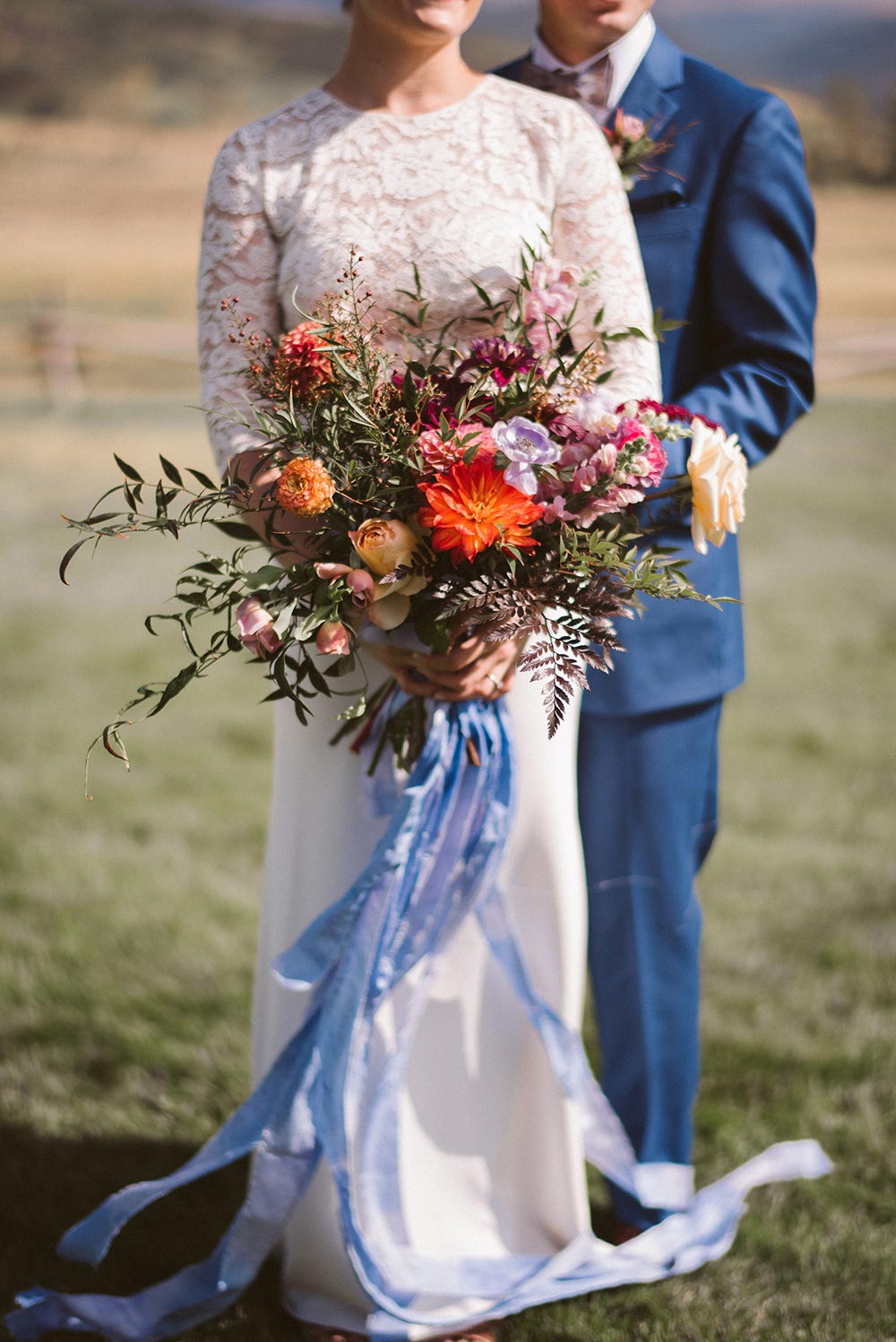 bridal bouquet flowy with blue ribbon wrap