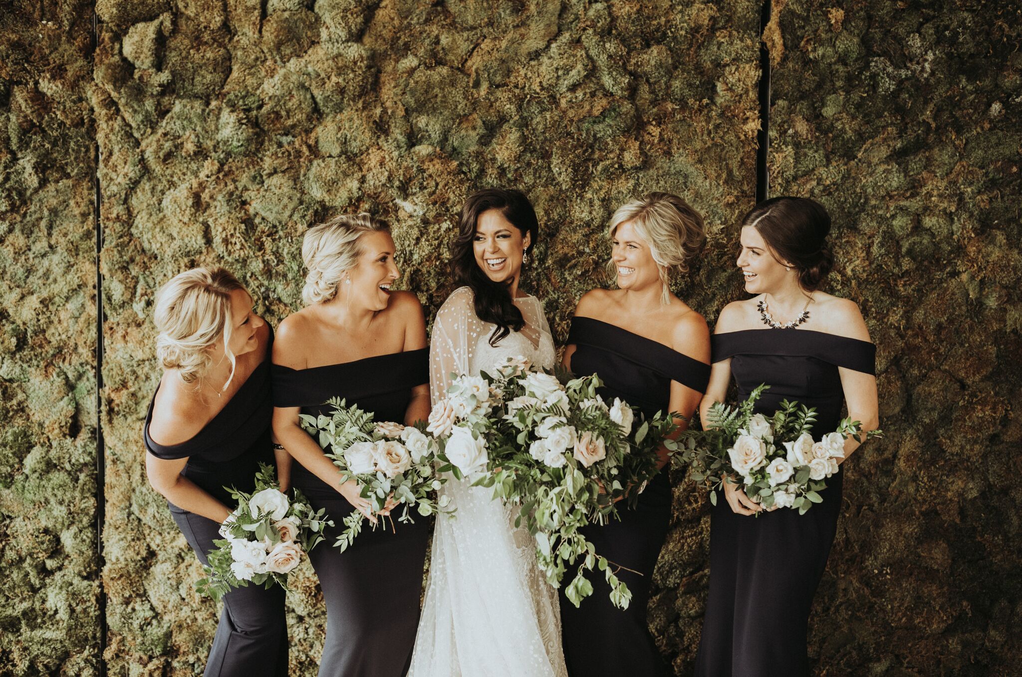 wedding party bridesmaids bouquets smiling