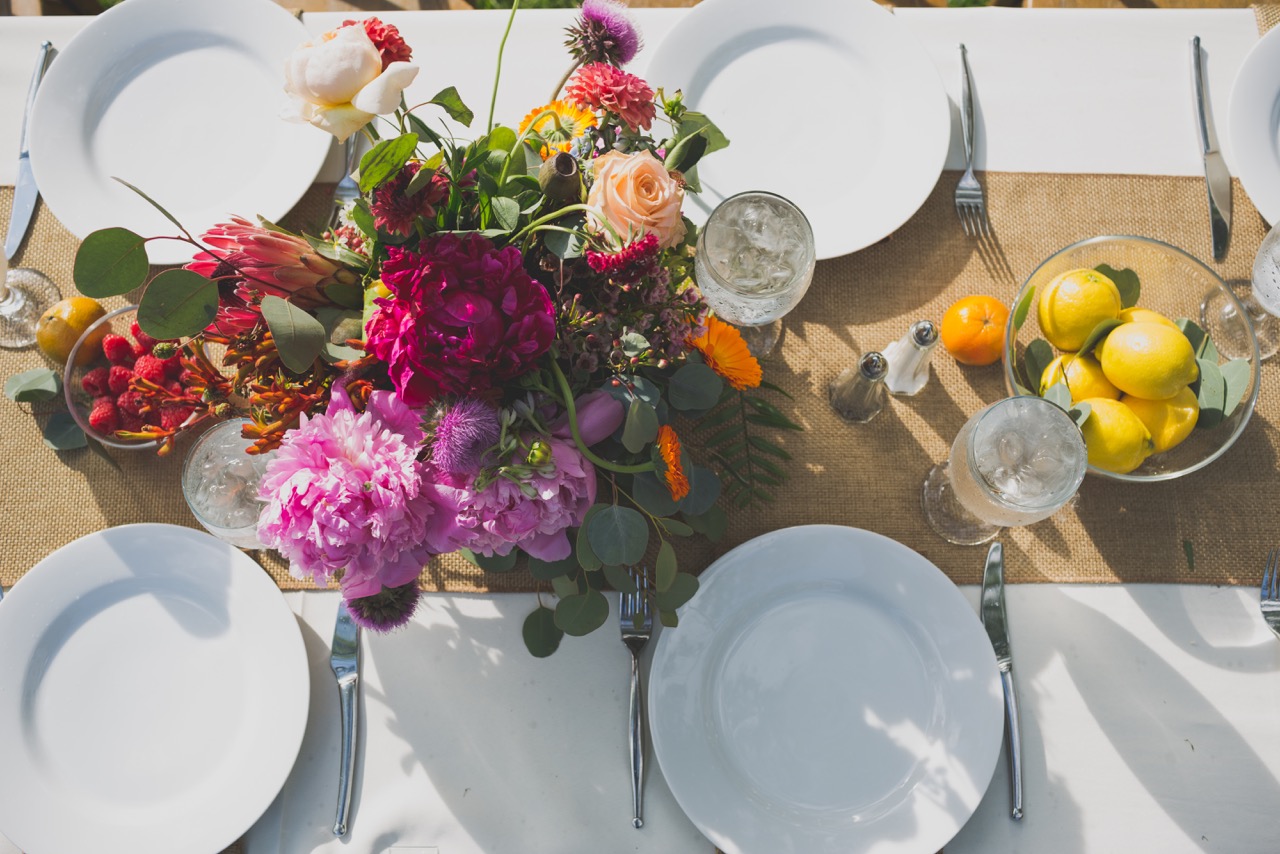 Fuschia and red floral tabletop white plates