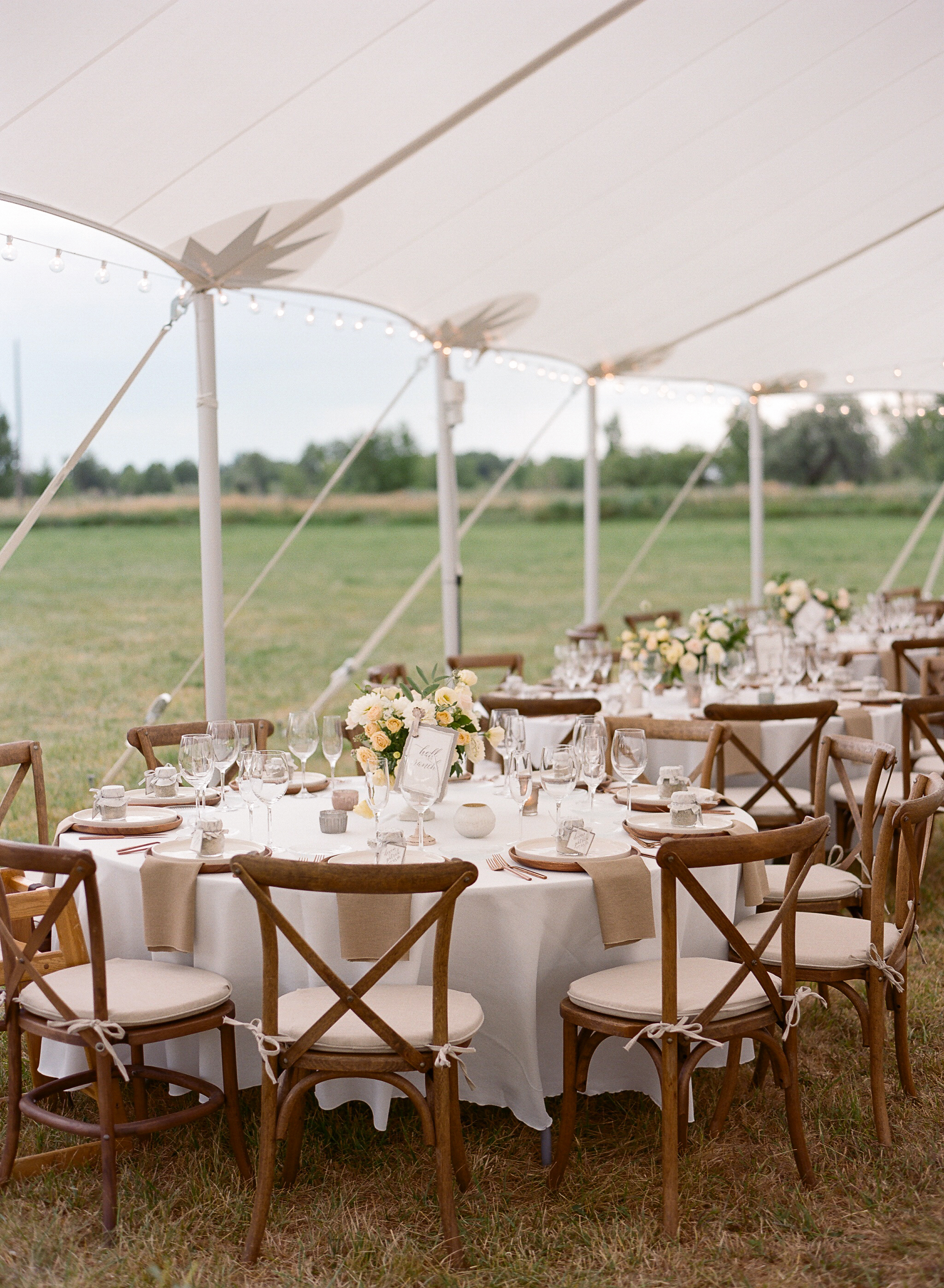 Wedding reception outdoor tent orange and yellow floral