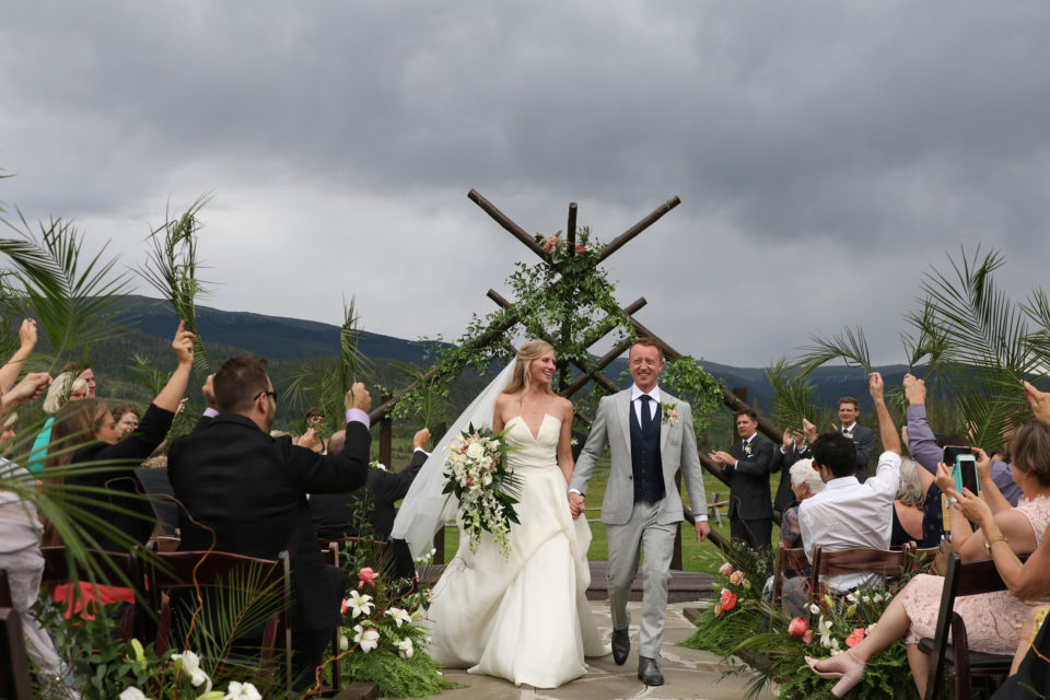 bride groom palms ceremony recessional mountain wedding