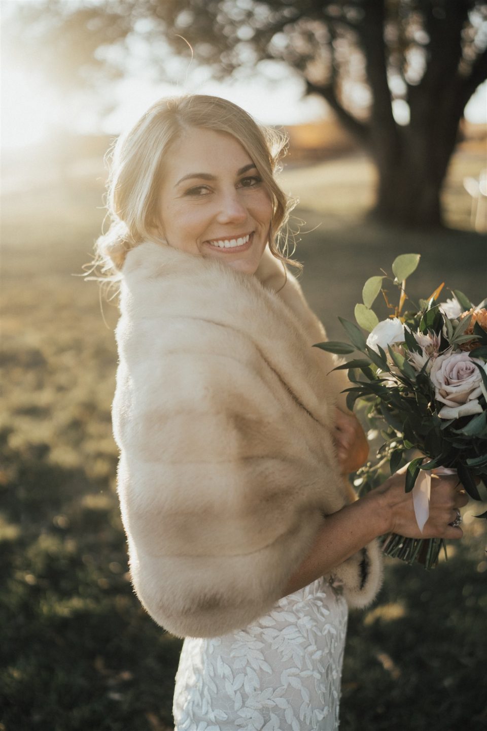 bride with fur shawl mountain wedding