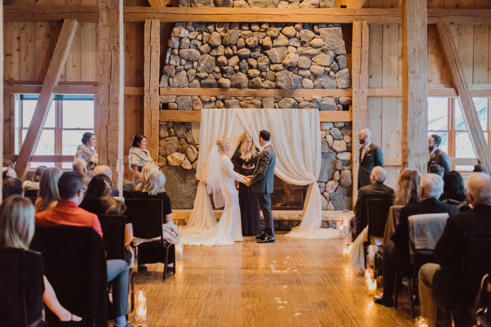 draped ceremony arch winter indoor wedding