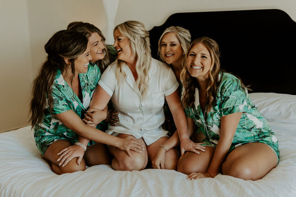 Bridesmaids in PJ's on bed